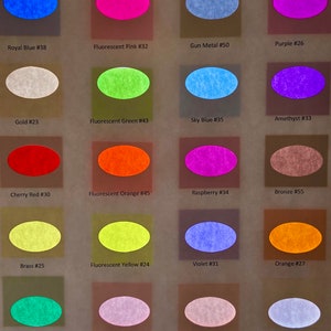 May include: A color chart featuring twenty oval swatches arranged in a grid. Each swatch is labeled with a color name and number, including Royal Blue #38, Fluorescent Pink #32, Gun Metal #50, Purple #26, Gold #23, Fluorescent Green #43, Sky Blue #35, Amethyst #33, Cherry Red #30, Fluorescent Orange #45, Raspberry #34, Bronze #55, Brass #25, Fluorescent Yellow #24, Violet #31, Orange #27, Emerald Green #40, Light Pink #28, Copper #29, and Platinum Gold #12.