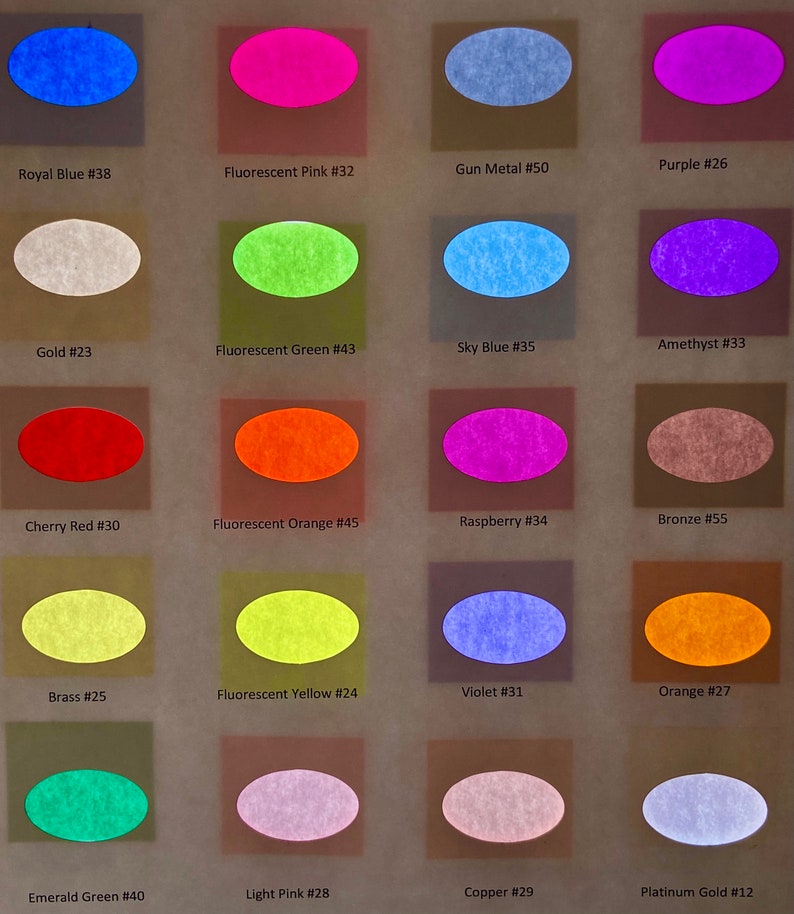 May include: A color chart featuring twenty oval swatches arranged in a grid. Each swatch is labeled with a color name and number, including Royal Blue #38, Fluorescent Pink #32, Gun Metal #50, Purple #26, Gold #23, Fluorescent Green #43, Sky Blue #35, Amethyst #33, Cherry Red #30, Fluorescent Orange #45, Raspberry #34, Bronze #55, Brass #25, Fluorescent Yellow #24, Violet #31, Orange #27, Emerald Green #40, Light Pink #28, Copper #29, and Platinum Gold #12.