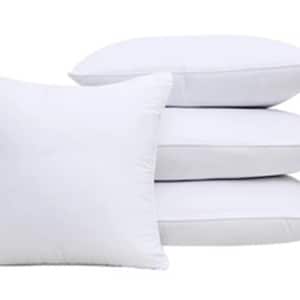 May include: Four white pillowcases stacked on top of each other. The pillowcases are made of a soft, smooth fabric.