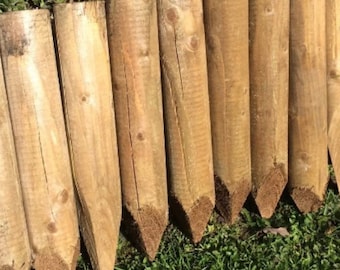14" long x 60mm diameter Wooden edging pegs, stakes sold in packs,  16 stakes cover 1 meter run. Pointed and pressure treated.