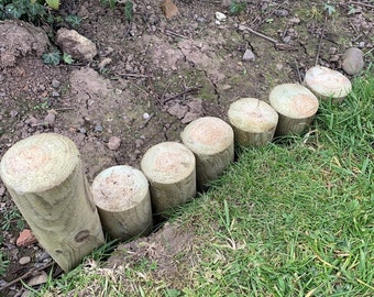 12" long x 60mm diameter round garden edging stakes long pointed, green pressure treated. 16 stakes will cover a 1 meter run. Loose log roll