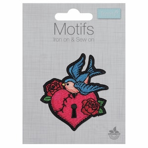 May include: Iron-on or sew-on patch featuring a blue bird perched on a pink heart with a keyhole. The heart is cracked and surrounded by red roses.