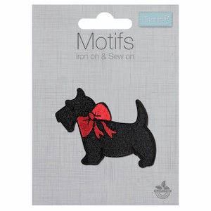 May include: Black iron-on or sew-on patch of a Scottish Terrier with a red bow. The patch is labelled "Motifs Iron on & Sew on" and "Trimits".
