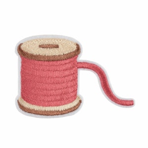 May include: A pink thread spool with a brown and beige centre, and a long pink thread tail.