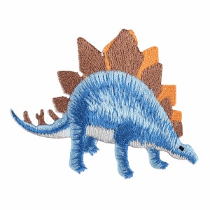 May include: Blue embroidered dinosaur patch with a brown and orange spiky back.