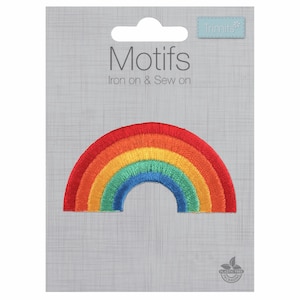 May include: Rainbow iron-on or sew-on patch. The patch is a colourful rainbow with red, orange, yellow, green, blue, and purple stripes. The patch is on a grey background with the text "Motifs Iron on & Sew on" and the brand name "Trimits".