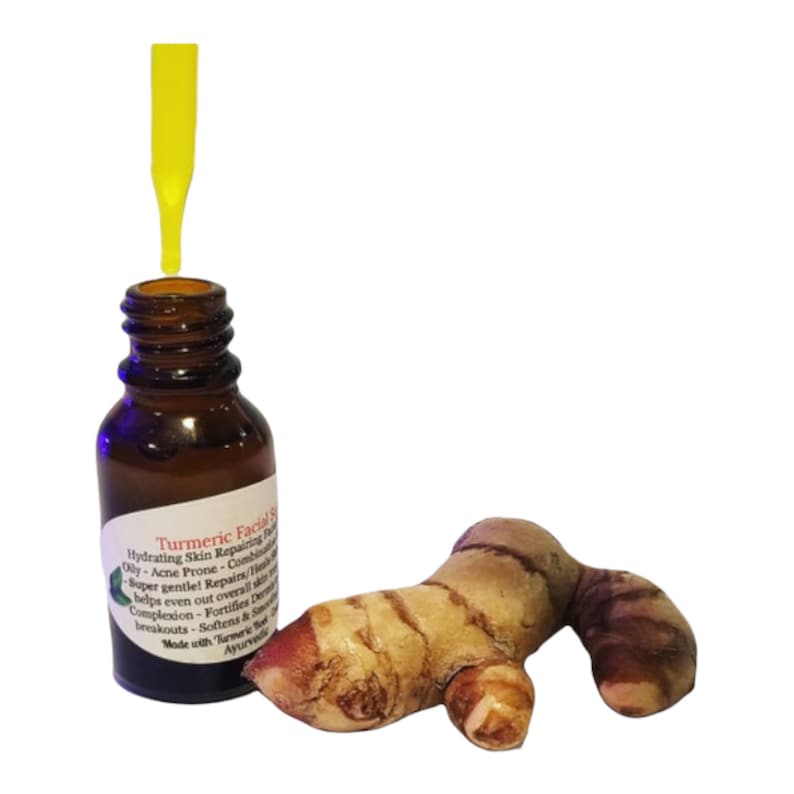 May include: A brown glass bottle with a yellow dropper, labeled "Turmeric Facial Serum," next to a fresh turmeric root. The serum is designed for hydrating and repairing skin, and is suitable for oily and acne-prone skin.
