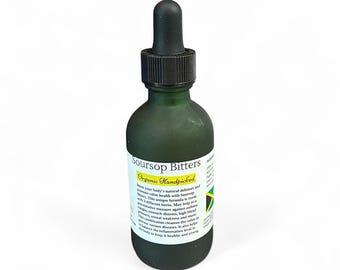 May include: A green glass bottle of Soursop Bitters with a black dropper. The label reads "Soursop Bitters Organic Handpicked". The bottle has a matte finish and is set against a white background.