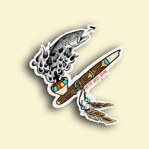 May include: A sticker featuring a stylized illustration of a fish jumping out of a pipe with smoke coming out of the bowl. The pipe is decorated with feathers and the text "OFF THE GRID JOHN".