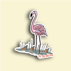 May include: A pink flamingo stands in shallow water with its long neck outstretched. Three red fish are partially submerged in the water, with only their tails visible. The text "OFF THE GRID JOHN" is written in orange at the bottom of the image.