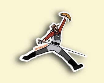 May include: A cartoon illustration of a person wearing a plaid shirt, a hat, and fishing waders, jumping in the air while holding a fish and a fishing rod. The text "OFF THE GRID OUTFITTERS" is on the rod.