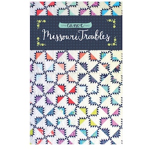 May include: A quilt pattern book titled "Missouri Troubles" by "one canoe two". The cover features a colorful quilt design with a navy blue background.