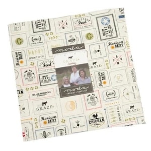 May include: A fabric panel with a white background and a repeating pattern of vintage-style labels with farm-related text and images. The labels are in various colors, including red, blue, green, and brown. The text on the labels includes "Graze", "Horizon Dairy", "Livestock Feed", "Farmer's Wheat", "Blue Ribbon", and "Chicken Company".