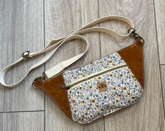 The Dayna Fanny Pack sling bag in waxed canvas and floral print.
