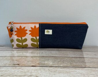 Extra Long Pencil Case for art, sewing, or school supply organization.  Orange and gold floral fabric with a flat bottom and wide open top.