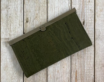 Cork Diva wallet women’s clutch with fabric lining and a variety of pocket styles. Holds cards, cash, checkbook and big enough for a phone.