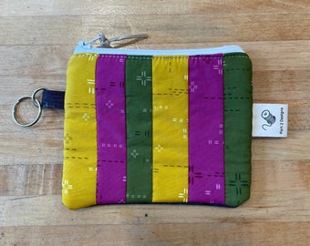Unique Denim and cotton zipper pouch/wallet. Holds cash, cards, keys, earbuds, supplies