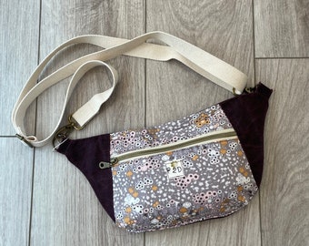 The Dayna Fanny Pack sling bag in waxed canvas and floral print.