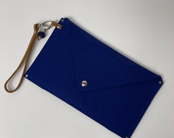 Blue clutch/wristlet made from merino wool felt with leather strap and glass bead adornment, one of a kind