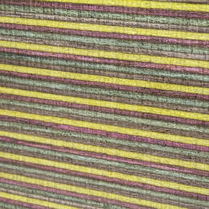 May include: Close-up of a wood veneer with alternating stripes of yellow, brown, pink, and green.