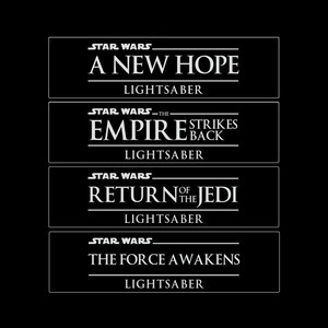 May include: A black and white image of four Star Wars movie titles with the text "Lightsaber" below each title. The titles are "A New Hope", "The Empire Strikes Back", "Return of the Jedi", and "The Force Awakens".