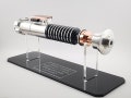 Class-I Tier Piano Black Acrylic Lightsaber Stand with Silver-Painted Engraved Text product logo