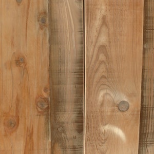 May include: Close-up of a wooden surface with a natural wood grain pattern. The wood is light brown with darker brown knots and streaks. The surface is smooth and appears to be made of planks.