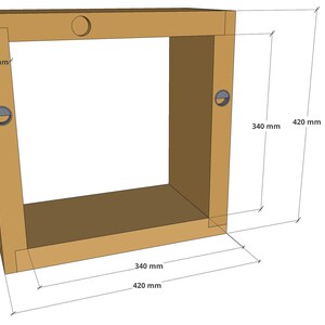 May include: A wooden frame with a shelf and two metal rings. The frame is 420 mm wide and 340 mm tall. The shelf is 420 mm wide and 40 mm deep.