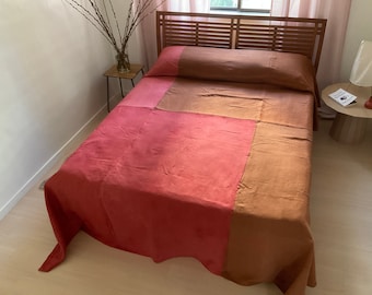 Hand dyed patchwork linen bedspread in terra cotta and cinnamon