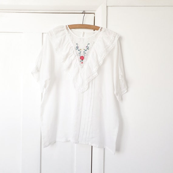 White Ruffle Blouse with Floral Embroidery . Large