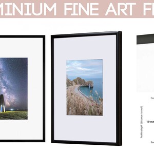 May include: Two black aluminum fine art frames with different images inside. The frame is 9 mm wide and 19 mm deep.