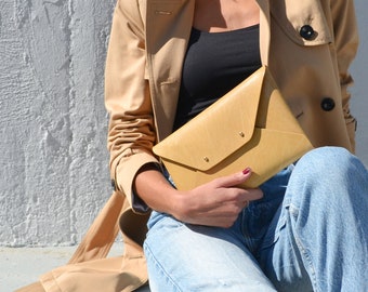 Tan leather clutch bag
