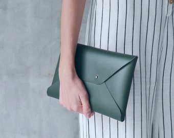 green leather clutch