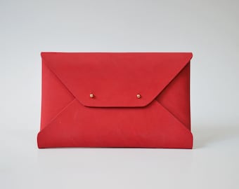 Red leather clutch bag