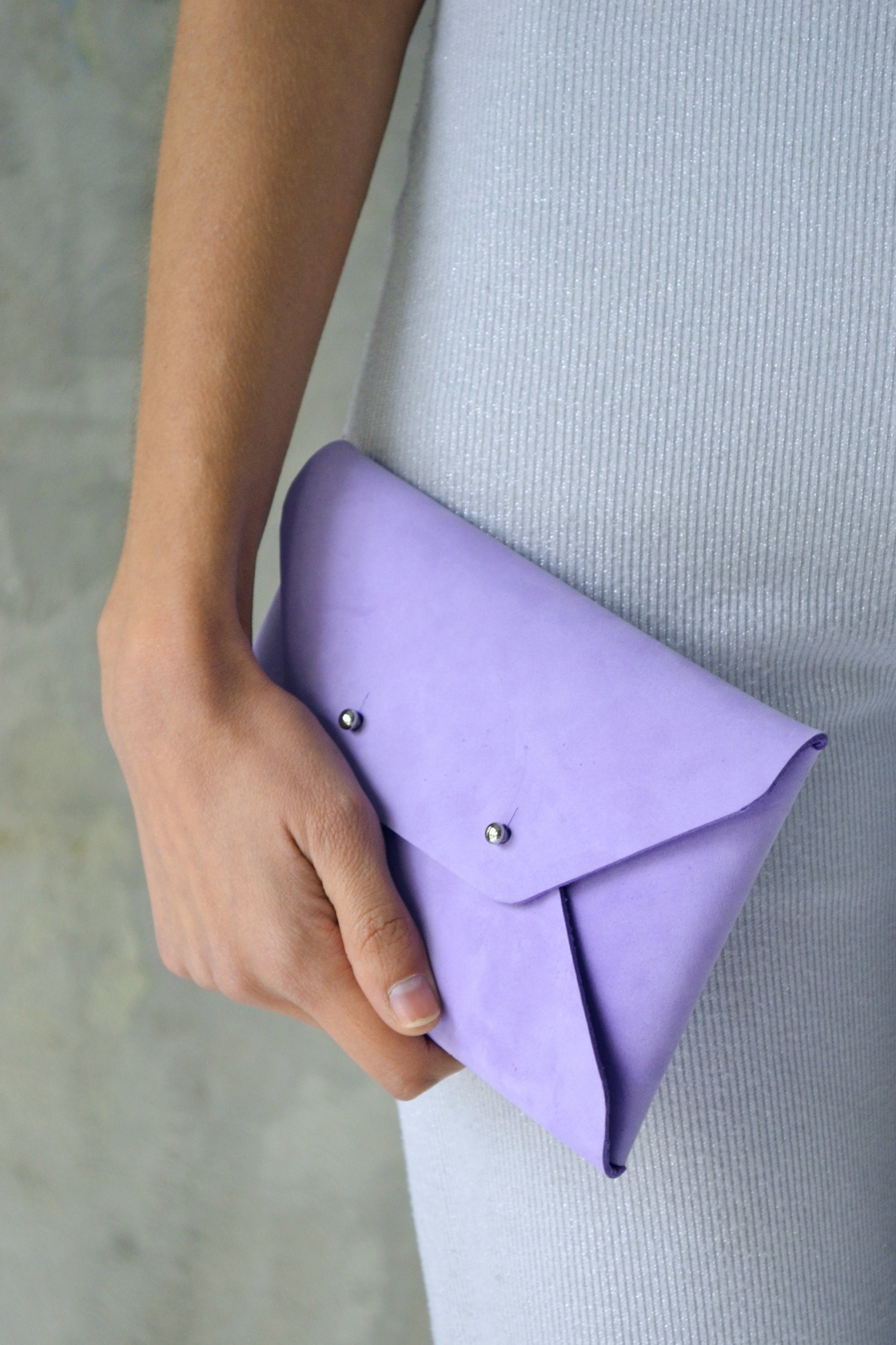 Purple leather clutch bag
