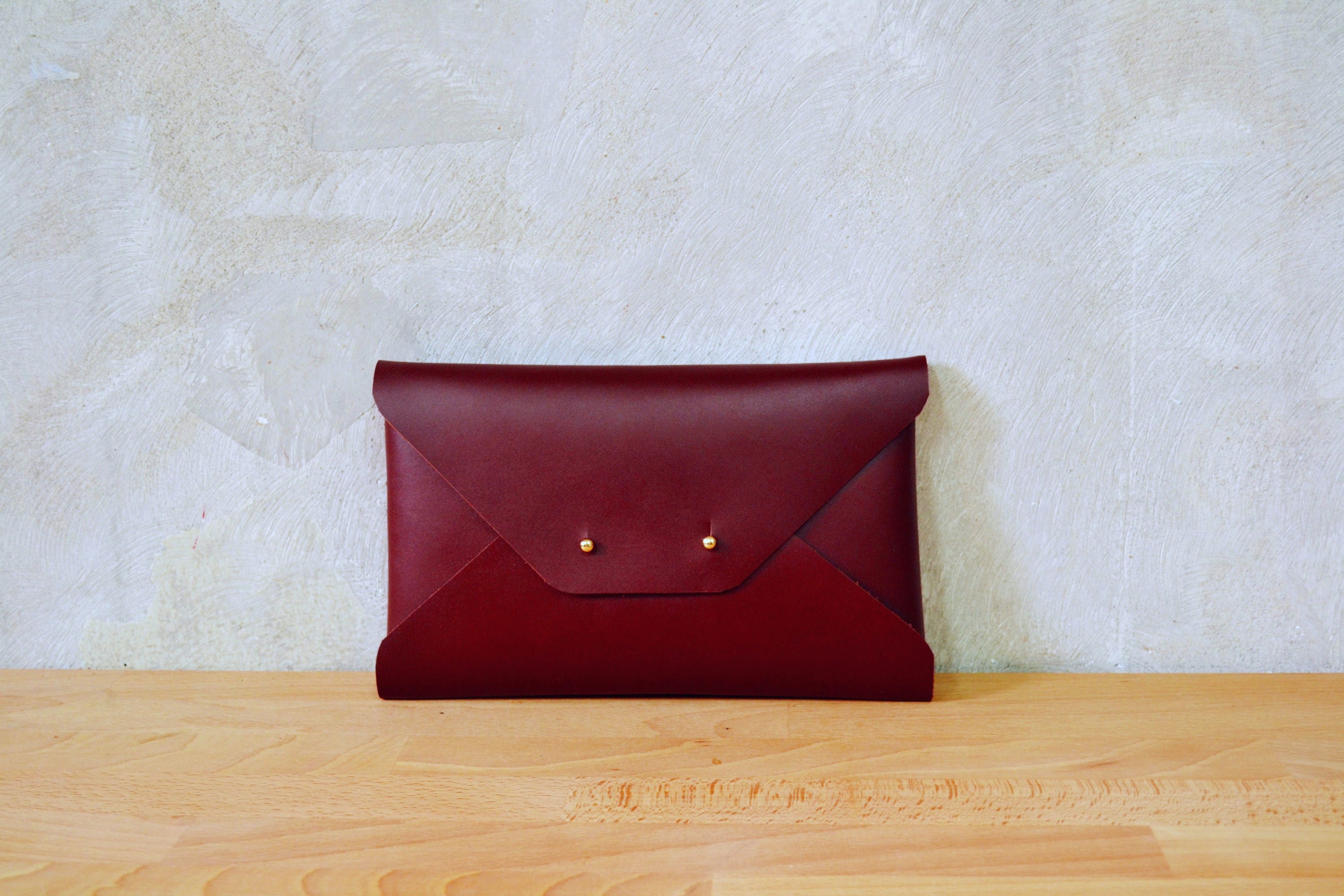 dark red clutch bag