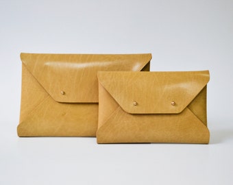 Tan leather clutch bag