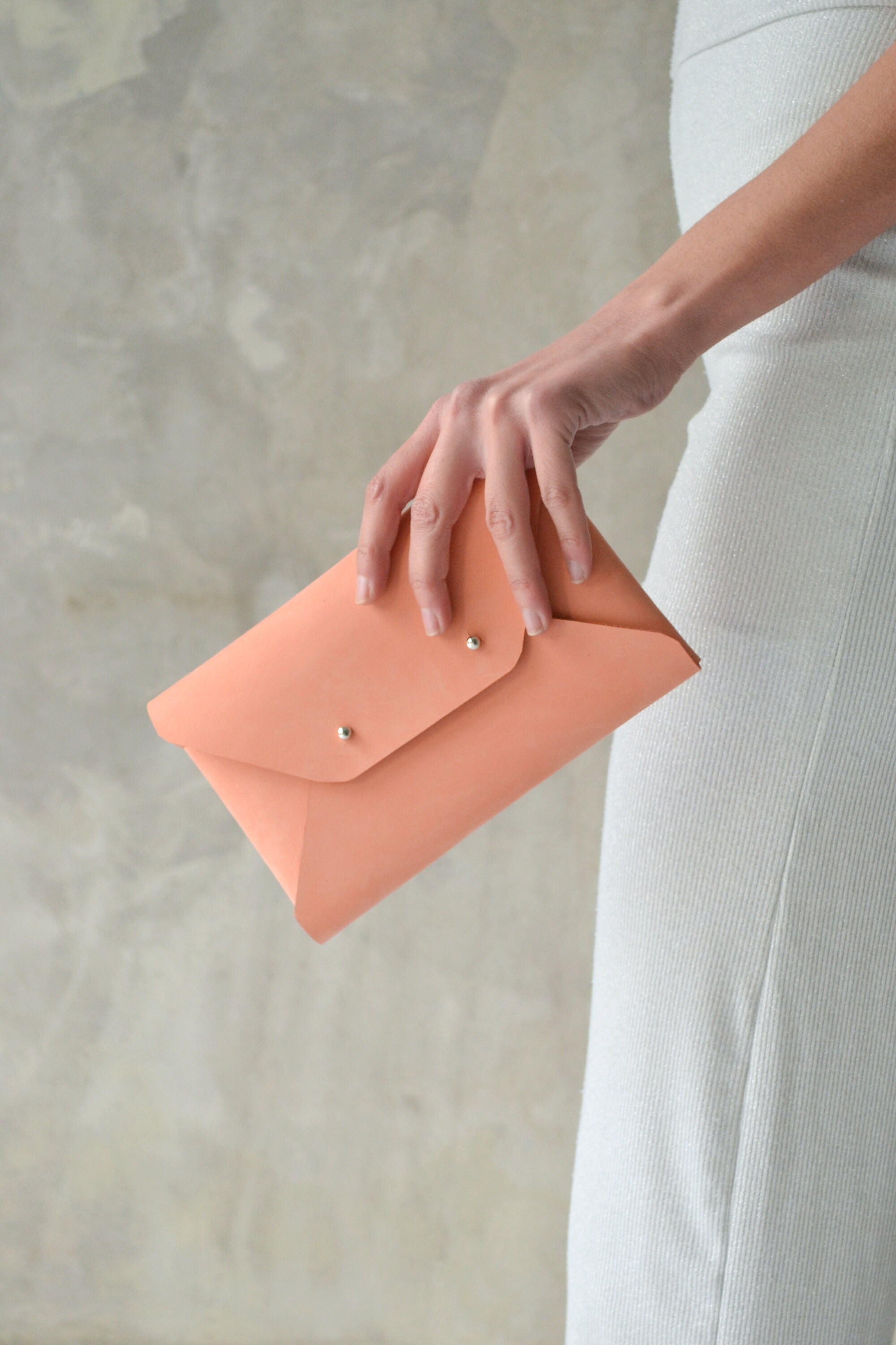 Peach leather clutch bag