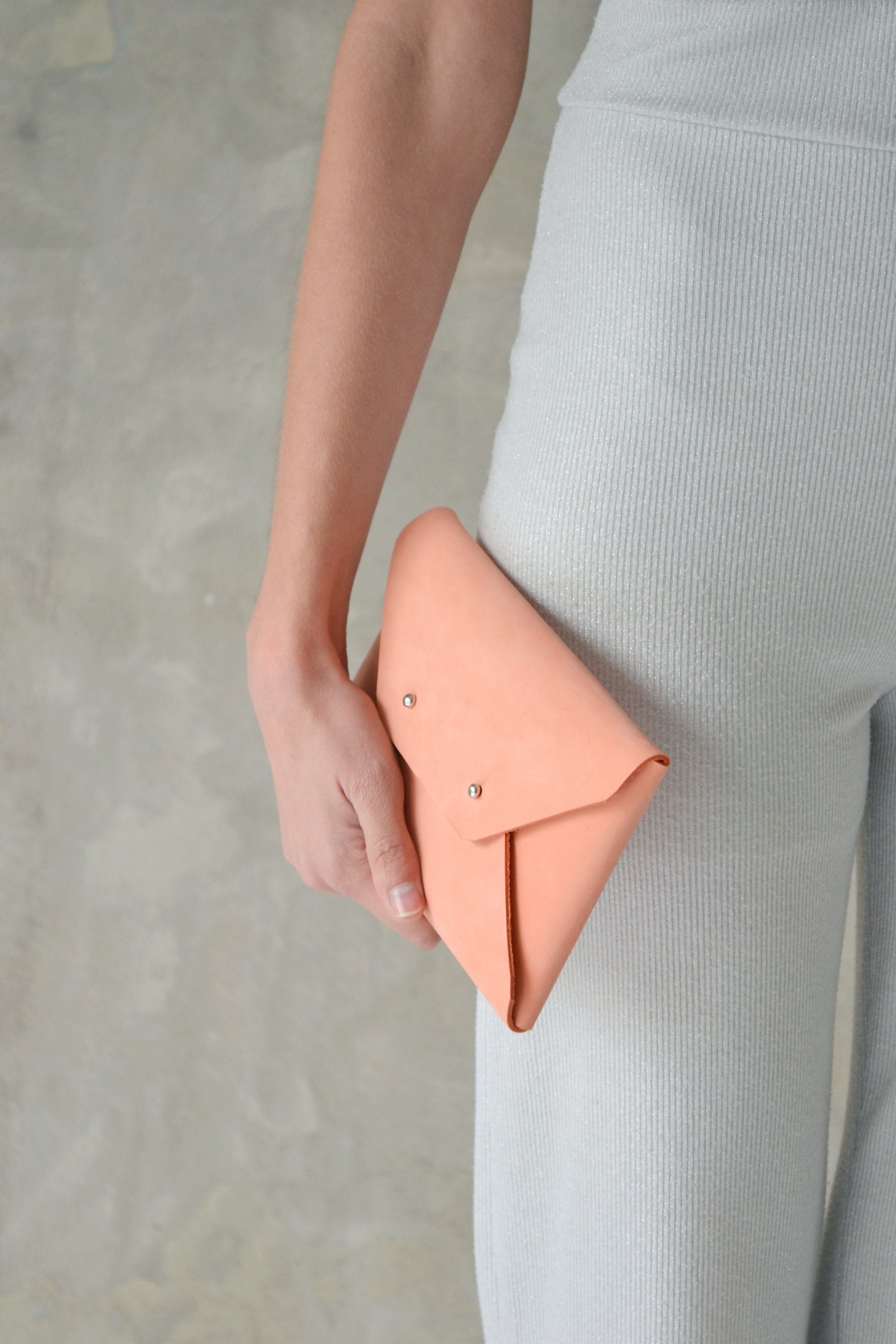 Peach leather clutch bag