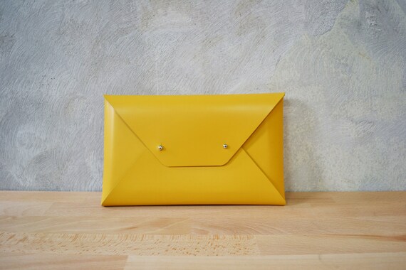 mustard clutch bag