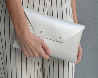 Pearl colored leather clutch bag