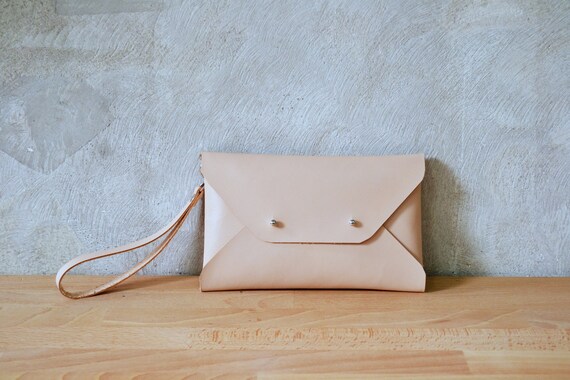 leather clutch bag with wrist strap
