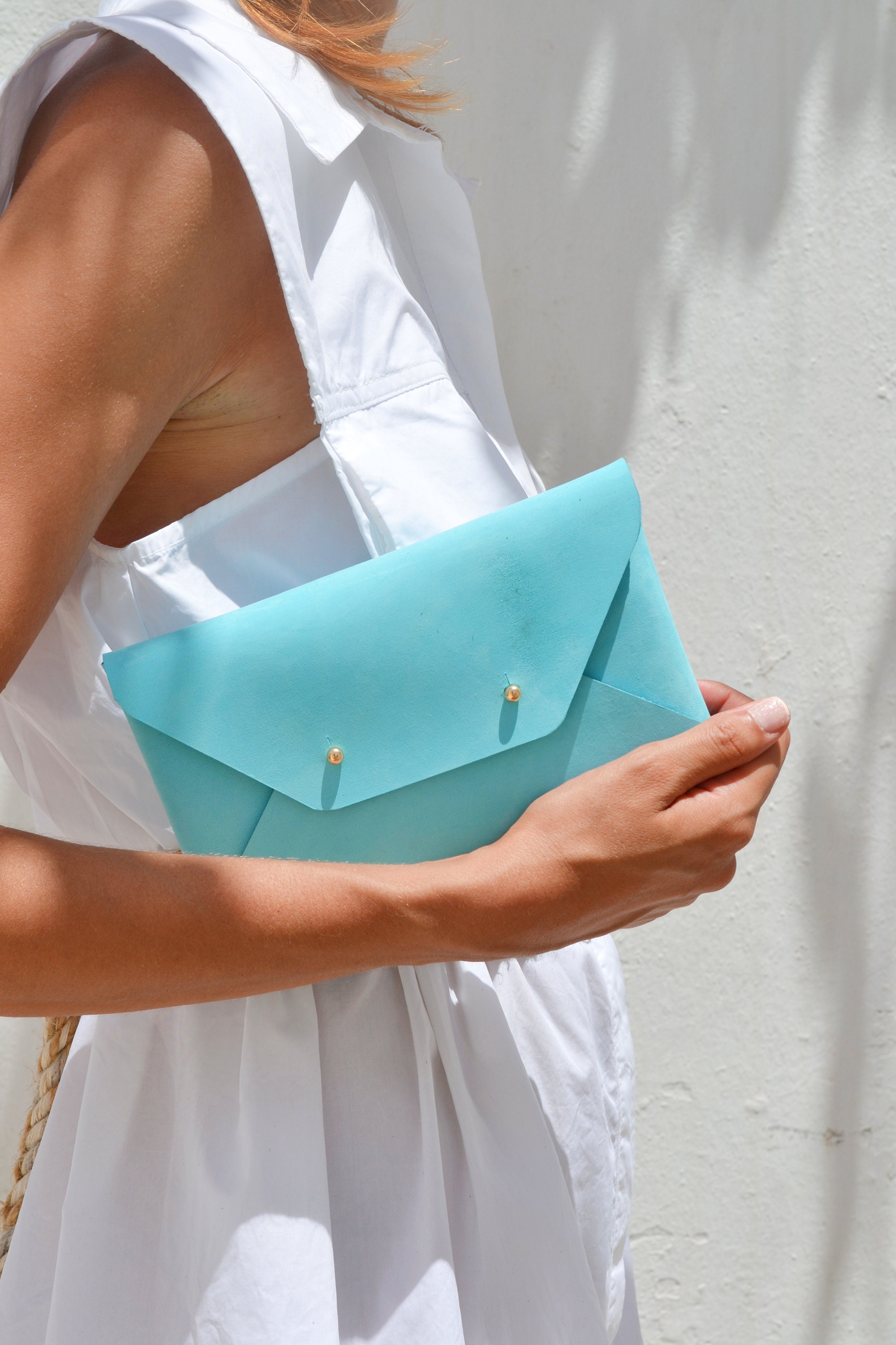 Light blue leather clutch bag