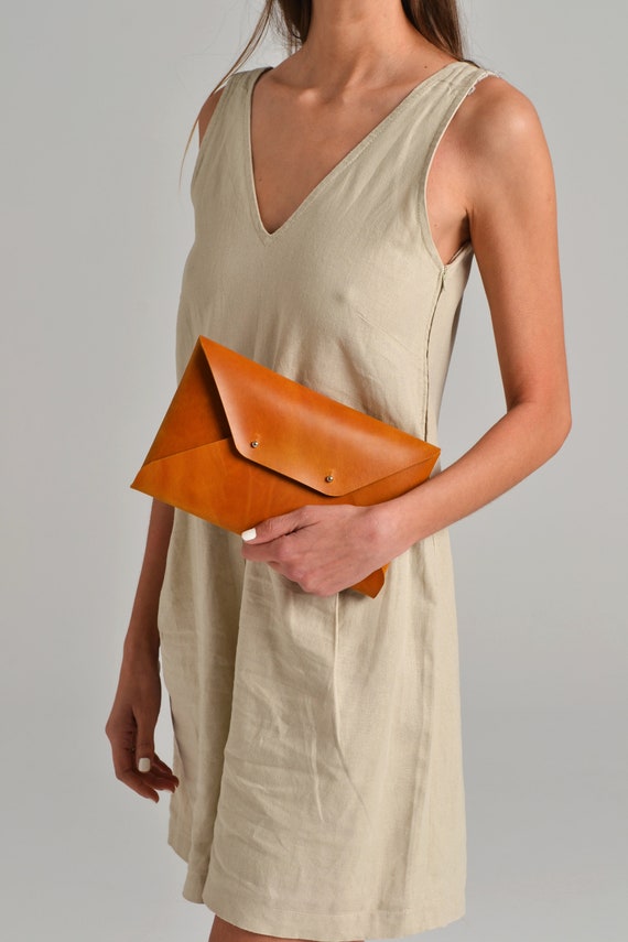 Ochre clutch shop bag
