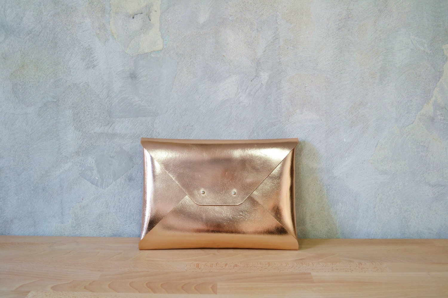 large rose gold clutch bag