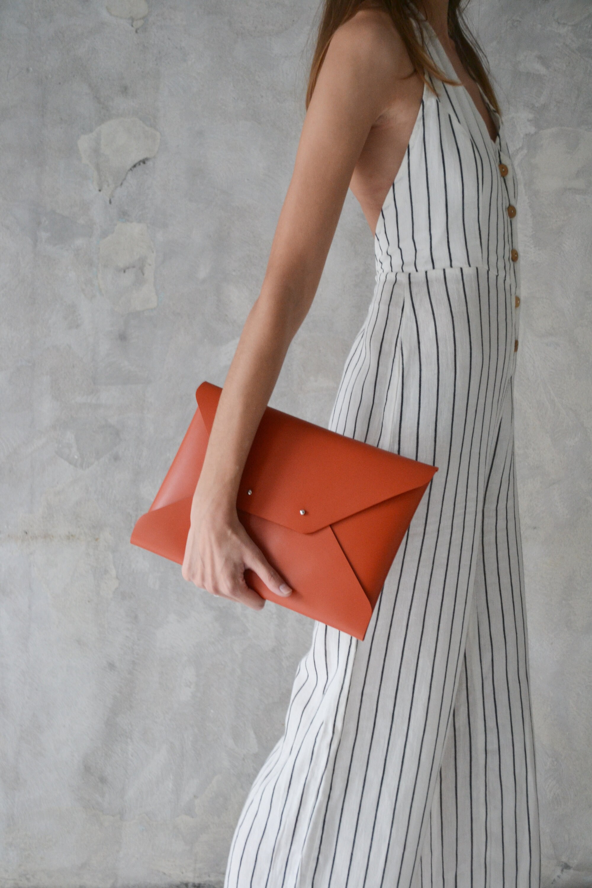 Burnt orange leather clutch bag