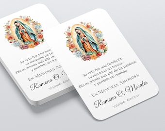 May include: Two white memorial cards with rounded corners. Each card features a watercolor image of a religious figure surrounded by flowers. Text in Spanish is printed on the cards, including the name "Ramona O. Morales" and dates.