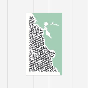 May include: A green and white map of a coastline with the names of various beaches and towns written on it. The names are written in a vertical column, starting at the top left corner and going down to the bottom right corner.
