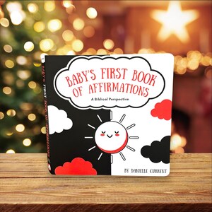 May include: A black and white book with a red sun and clouds. The title is "Baby's First Book of Affirmations: A Biblical Perspective" by Danielle Current.