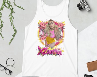 May include: White tank top with a colorful graphic of a woman in a pink and yellow outfit with wings. The text "Xanthia" is written in pink and yellow letters.